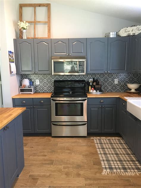 blue kitchen cabinets with stainless steel countertops|blue cabinets butcher block countertops.